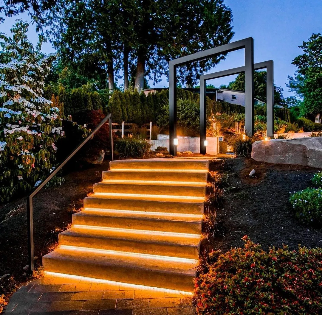 Steel arches over lit stairs