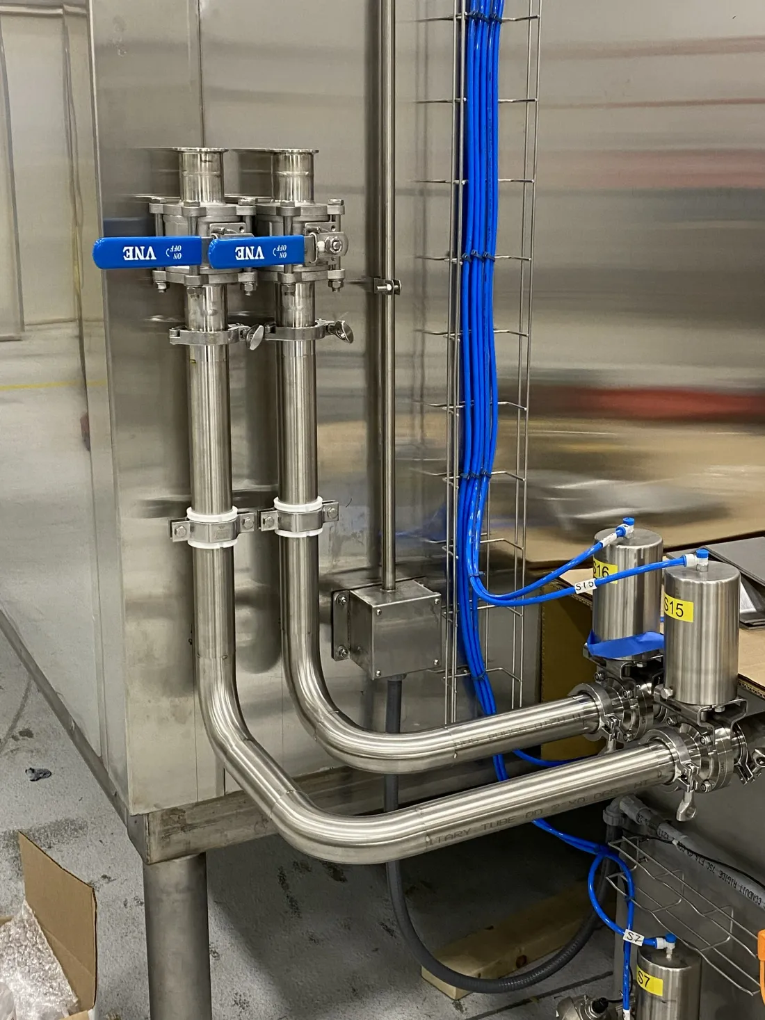 Stainless sanitary piping installed in a food processing facility
